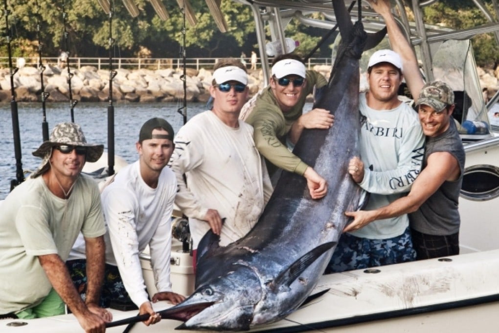A group of Hong Kong anglers with their prize catch of a 226kg Pacific blue marlin. Photo: Brad Ainslie