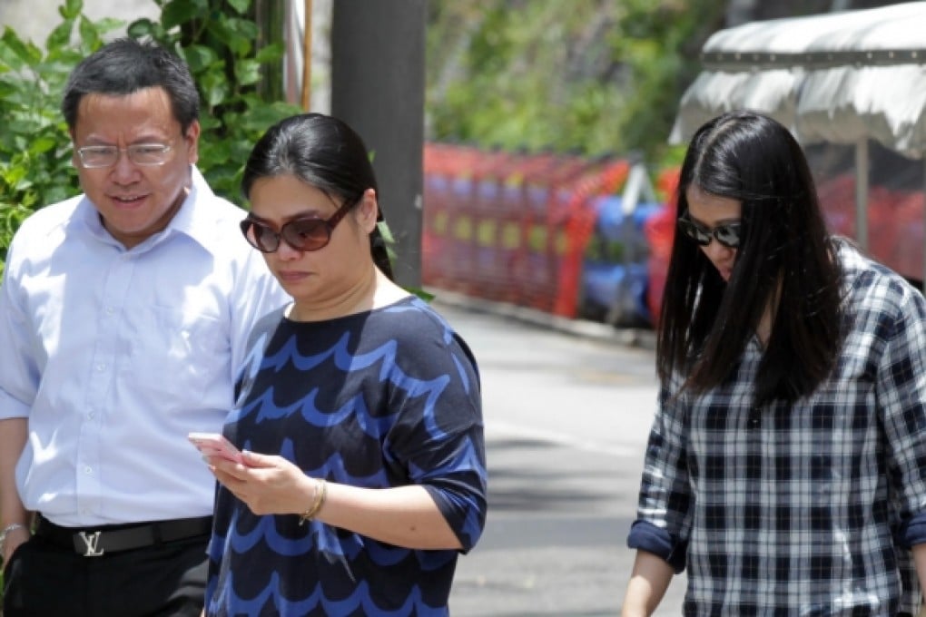 Tam Miu-ching (centre), wife of Peter Chan, and his daughter Polly Lon Pui-chun (right) leave Stanley Prison. Photo: SCMP