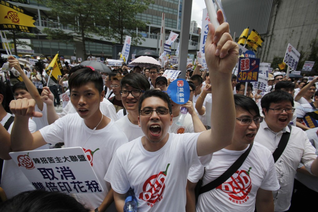 Property agents protest outside government headquarters in Tamar on Sunday. Photo: Reuters