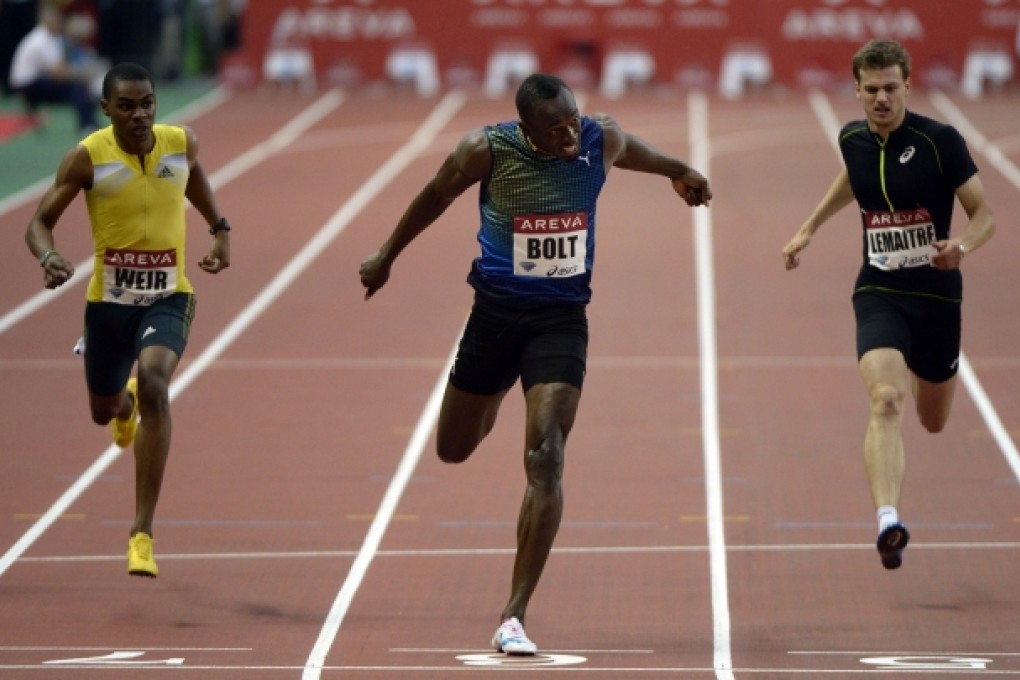Jamaica's Usain Bolt (centre) crosses the finish line to win the men's 200m at the IAAF Diamond League athletics meeting in Saint-Denis, Paris. Photo: AFP