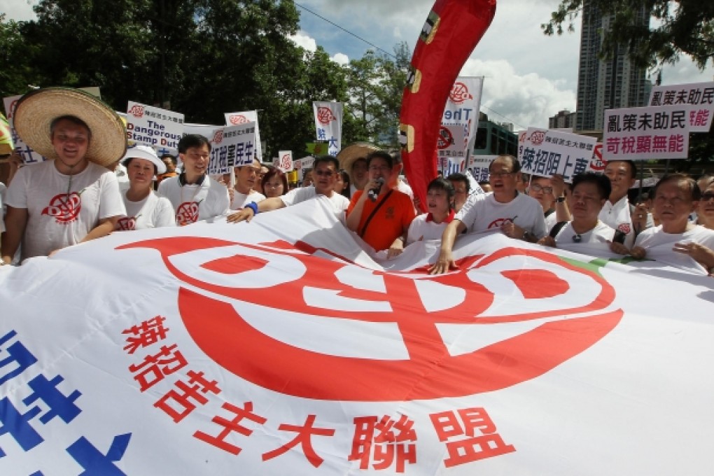 Real estate agents marching yesterday to convey their opposition to the government's property-market cooling measures. Photo: Nora Tam