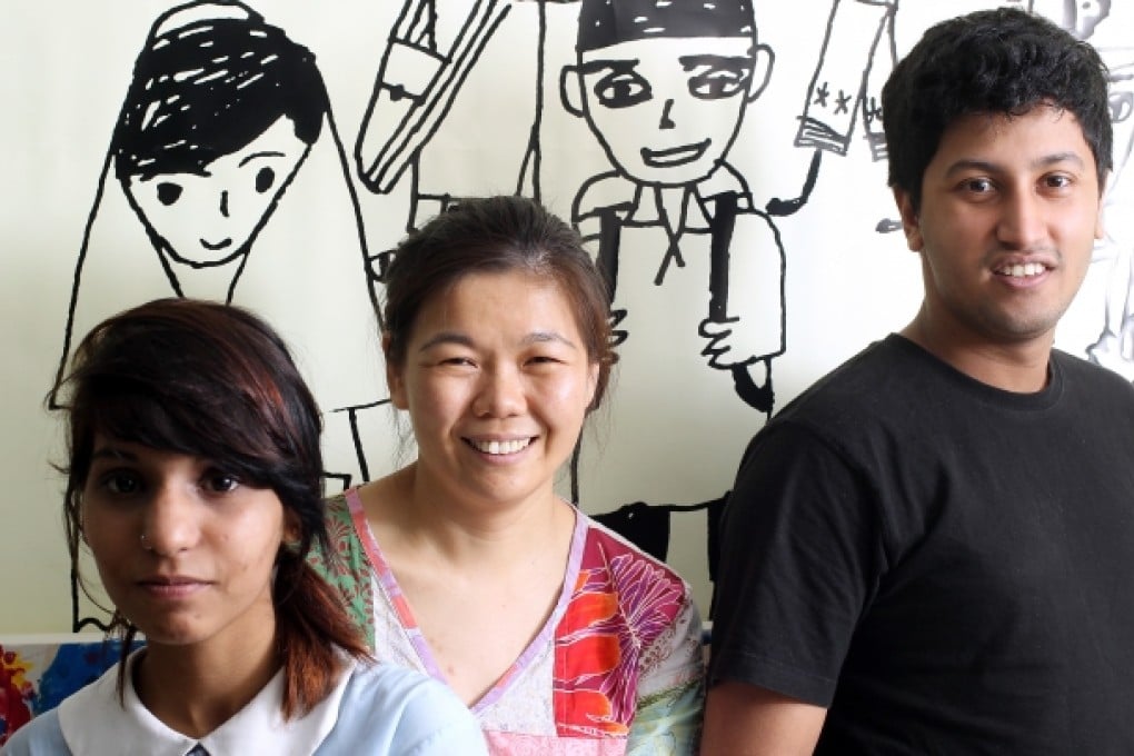 Fermi Wong (centre) with ethnic minority students Igra Khan (left) and Thas Mohamed. Photo: K. Y. Cheng