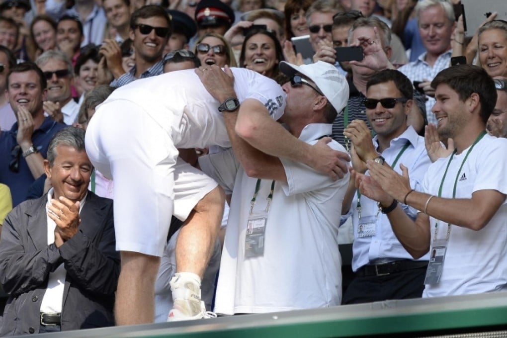 Andy Murray hugs his coach Ivan Lendl after finally securing his first Wimbledon title, something Lendl himself never managed. Photo: AFP
