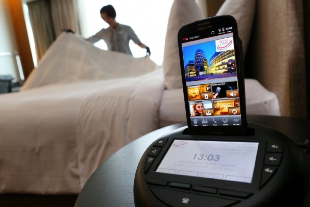 The Hotel Icon tests the multipurpose docking station for smartphones. Photo: Dickson Lee
