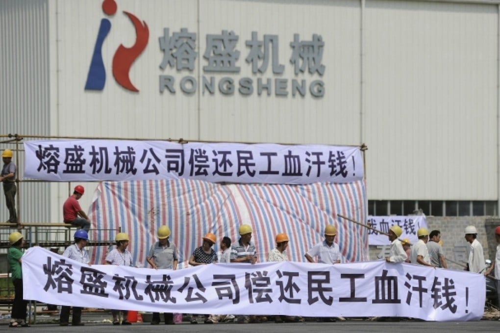 Rongsheng workers demonstrate in a protest calling for overdue salaries on Monday. Photo: Reuters