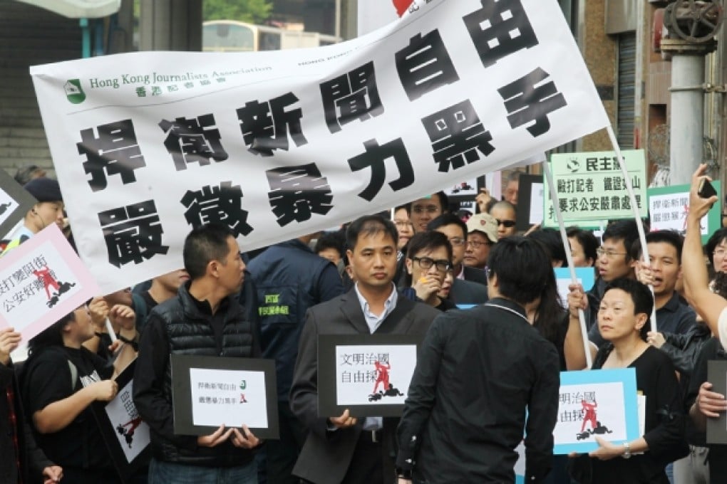 Members of The Hong Kong Journalists Association and the Hong Kong Press Photographers Association march to condemn the attacks on Hong Kong journalists in Beijing in March this year. Photo: K.Y. Cheng