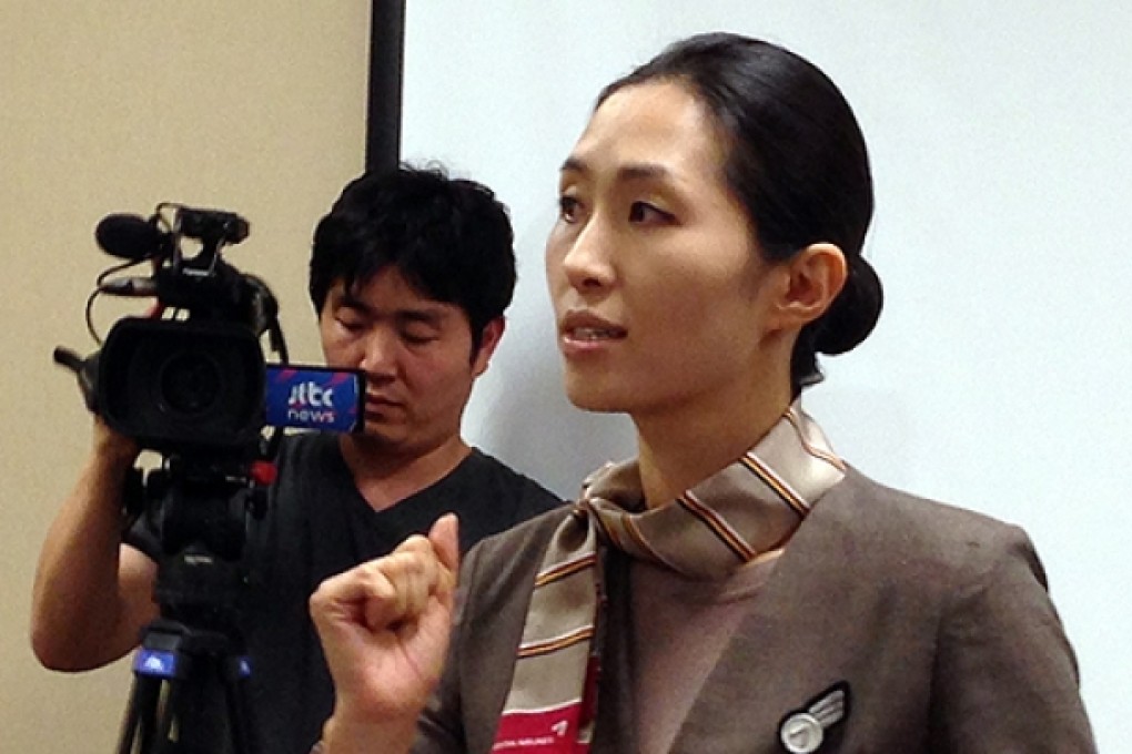 Flight attendant and cabin manager Lee Yoon-hye speaks to the media on Sunday. Photo: AP