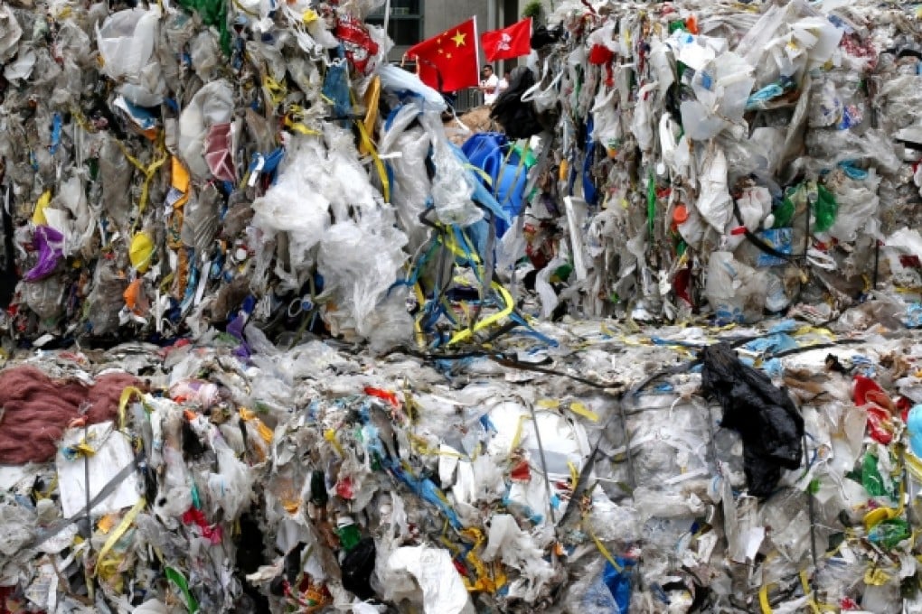 Plastic waste dumped at Legco yesterday by recyclers complaining that tighter mainland rules on waste imports have forced such waste into the city's landfills. Photo: Sam Tsang