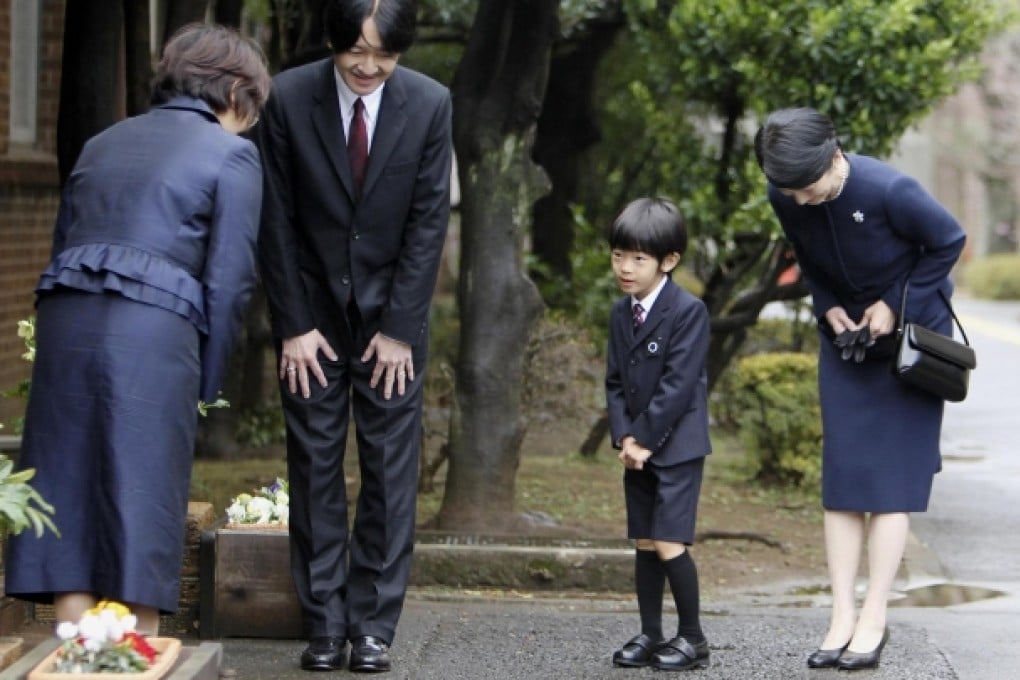 Prince Hisahito, with father Prince Akishino (second, left) and mother Princess Kiko (right), in a rare public appearance. Photo: Reuters
