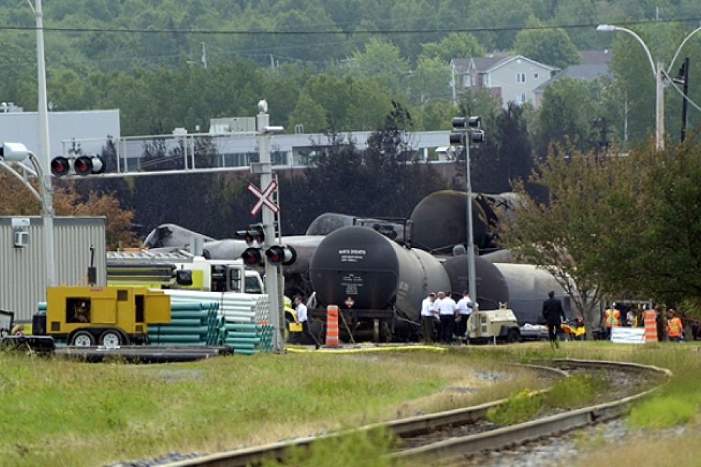 Investigators work at the train derailment site in Lac-Megantic, Quebec. Photo: AFP