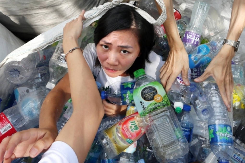 Friends of the Earth member Celia Fung protests for a better government recycling policy. Photo: Sam Tsang