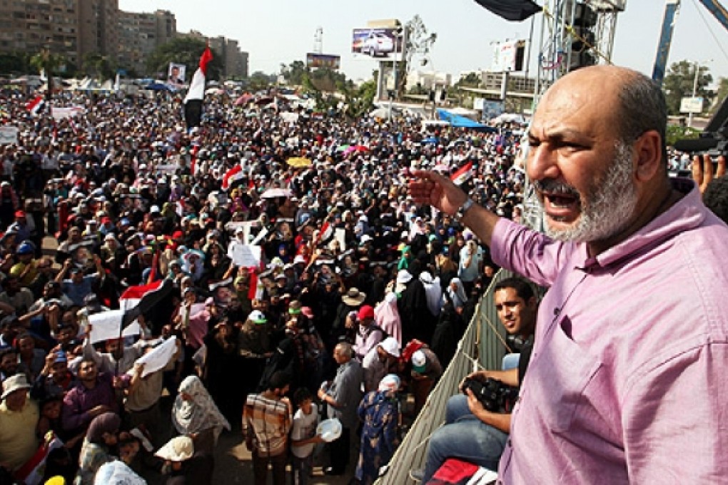 Egyptian member of the Muslim Brotherhood Safwat Hegazy (right) shouts slogans as Egyptian supporters of ousted president Mohammed Mursi protest outside Rabaa al-Adawiya mosque in Cairo on Monday. Photo: EPA