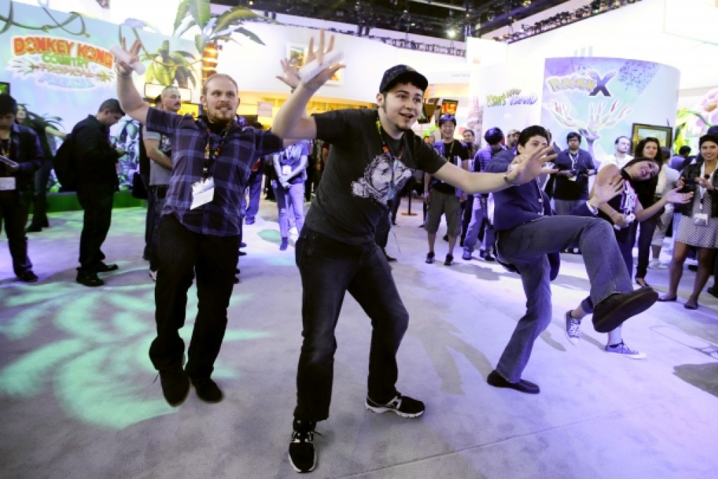 Members of the public check out a Nintendo video game at last month’s Electronic Entertainment Expo in Los Angeles. Photo: AP