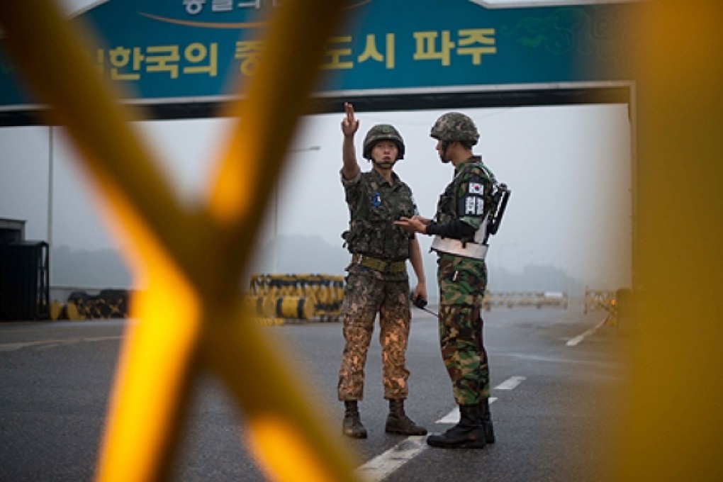 South Korean soldiers stand at a military checkpoint leading to North Korea's Kaesong joint industrial complex, in the border city of Paju early on Wednesday. Photo: AFP