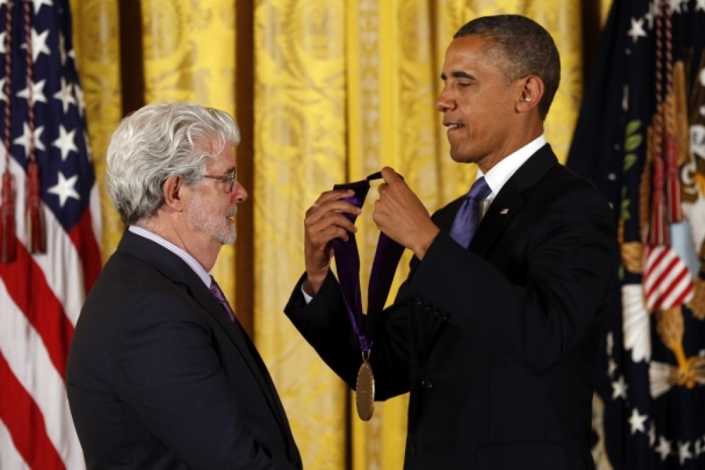President Obama awards the National Medal of Arts toStar Wars producer George Lucas. Photo: Reuters