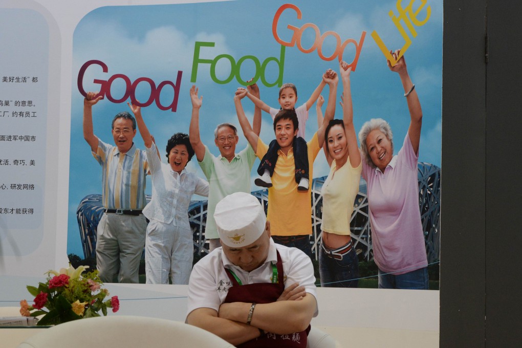 A Chinese cook snoozes at the China International Food Safety Technology & Innovations Expo in Beijing in June. Photo: AFP