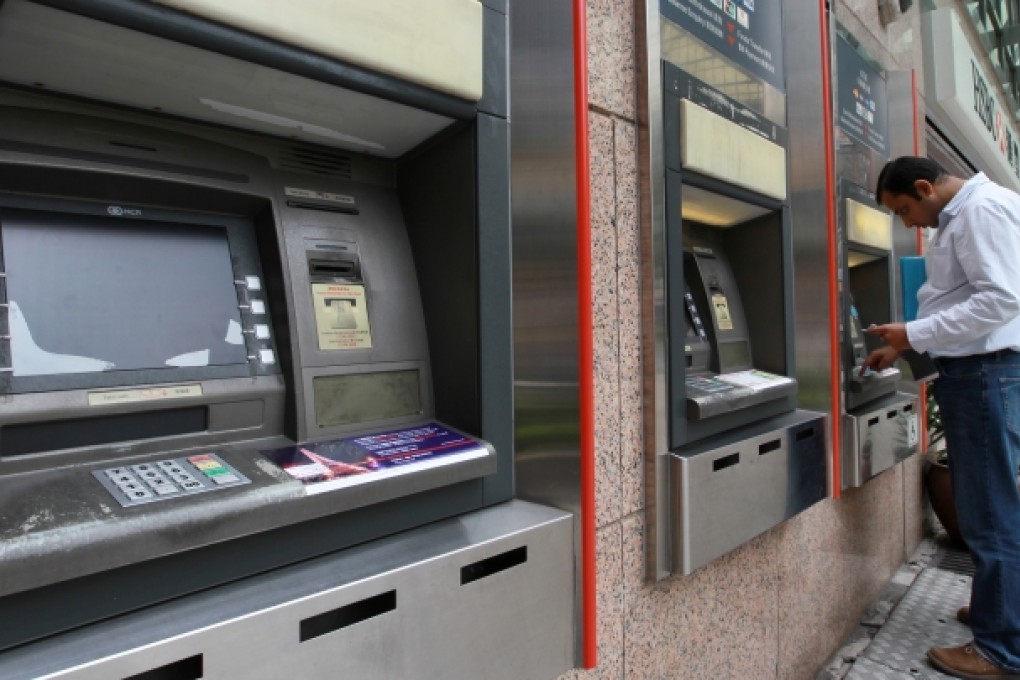 People use HSBC's ATM at East Ocean Centre. Photo: Edward Wong