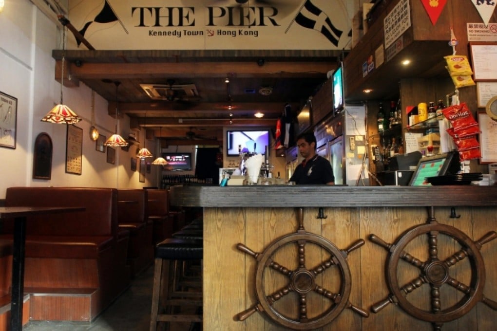 A mojito (left); the interior of the Old China Hand; a pint of Guinness.Photos: Felix Wong