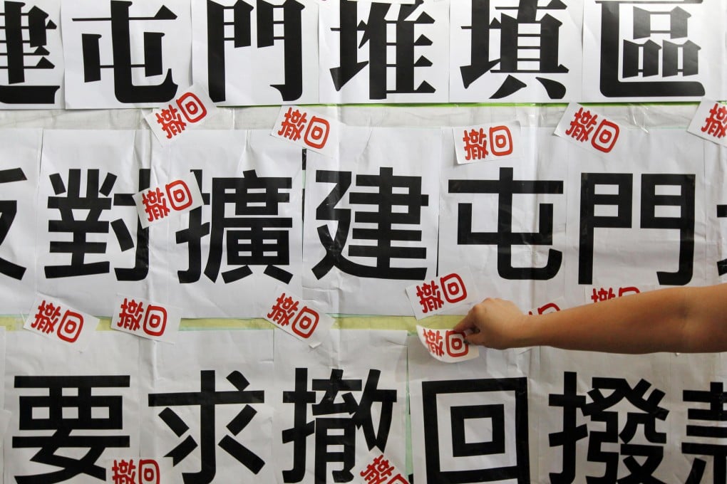 Residents of Tuen Mun send a clear message outside Legco that they object to the government's landfill proposals. Photo: Felix Wong