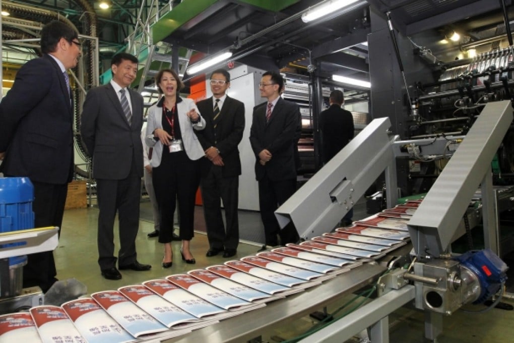 A ceremony marks the commissioning of the SCMP's new printing presses, bought from German firm Manroland Web Systems. Photo: May Tse