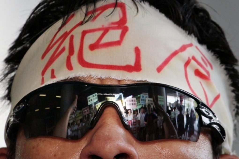 A protester taking part in a hunger strike outside the Legislative Council against plans to expand landfills. The Finance Committee later voted to defer discussion on the controversial issue. Photo: Felix Wong