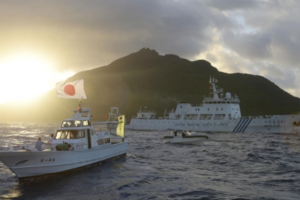 Chinese and Japanese surveillance ships sail near the disputed Diaoyu Islands. Photo: AP