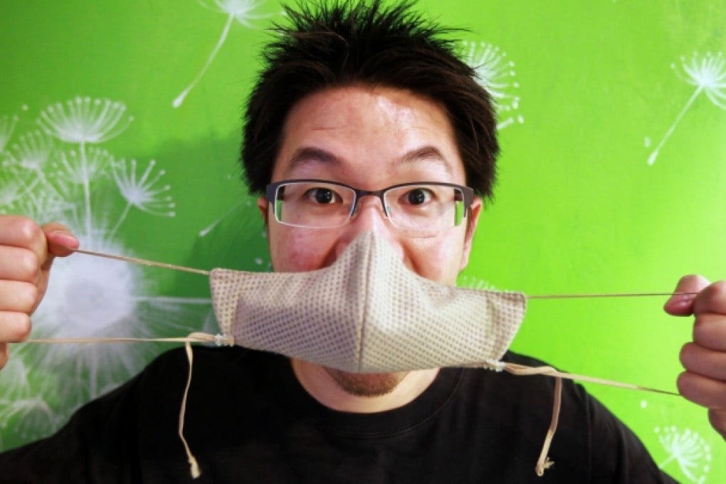 Kelvin Lau, a Chinese-Canadian, shows one of his face masks. Lau used to work as an engineer in Beijing, and now runs an online shop selling masks. Photo: Simon Song