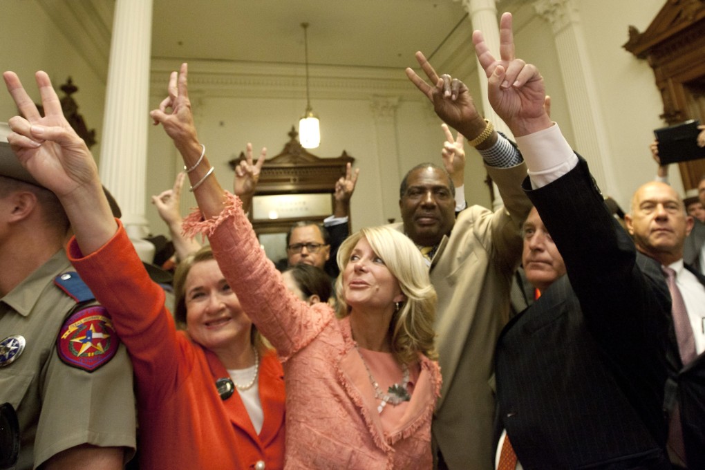 Texas state senators greet abortion rights advocates to show they voted against HB2, which the Senate approved late on Friday night. Photo: AP