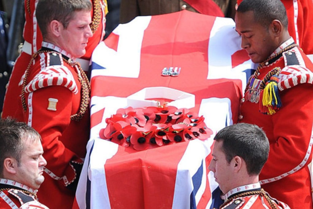 Soldiers carry Lee Rigby's coffin from the church. Photo: EPA