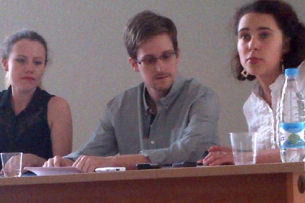 Edward Snowden (centre) during a press conference he gave in Sheremetyevo airport. Photo: Human Rights Watch