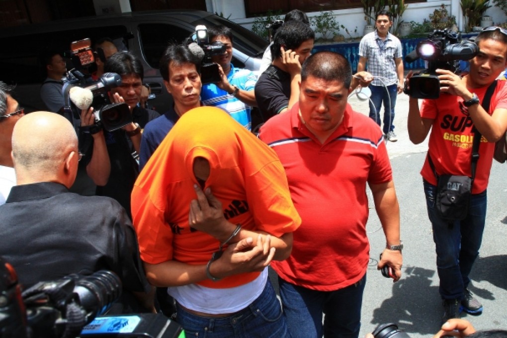 One of the alleged kidnappers was arrested. Davao police said its officers had shot and killed three gangsters in a shoot-out on the streets. Photo: Xinhua