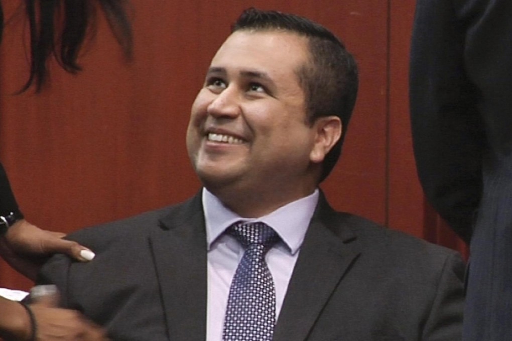 George Zimmerman smiles after hearing the verdict. Photo: AP