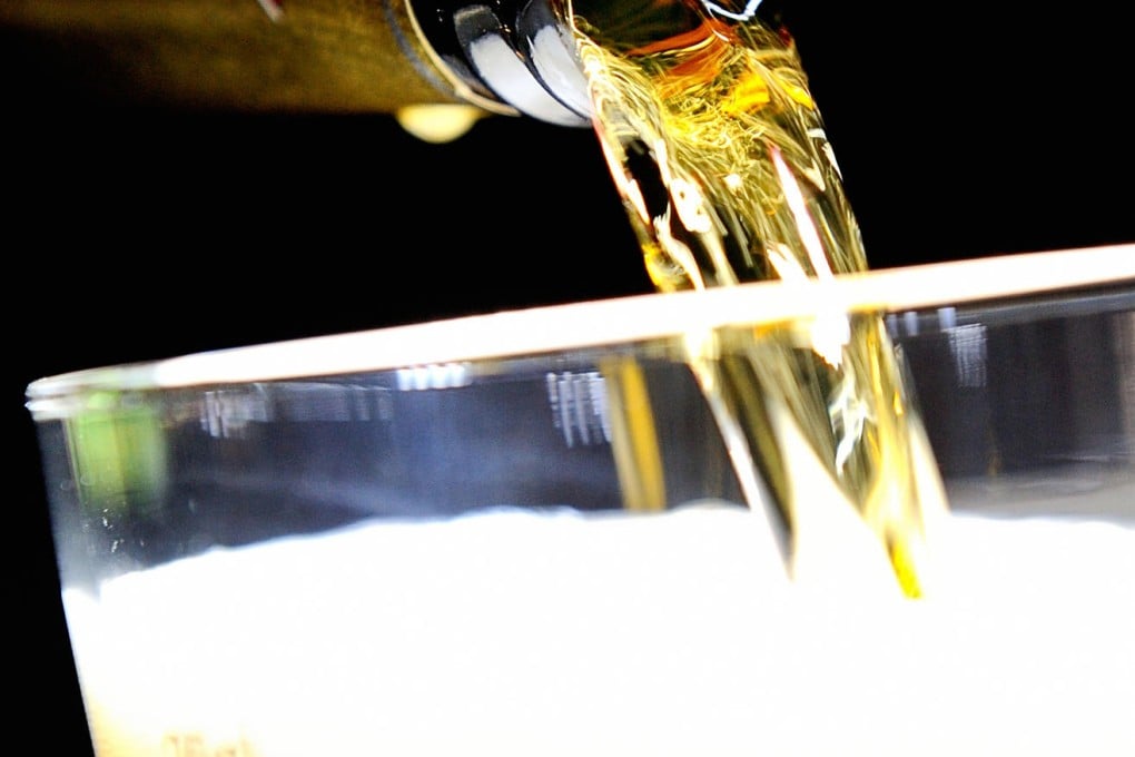 A pint of lager has the same number of calories as three chocolate digestive biscuits. Photo: Philippe Huguen