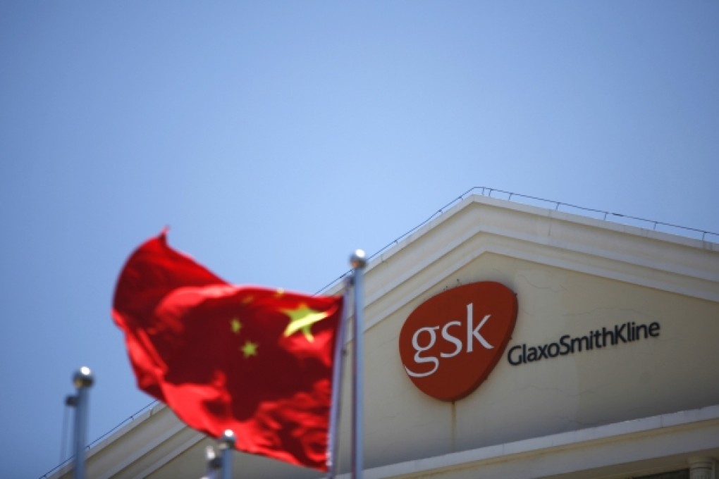 A Chinese national flag fluttering in front of a GlaxoSmithKline (GSK) office building in Shanghai. Photo: Reuters