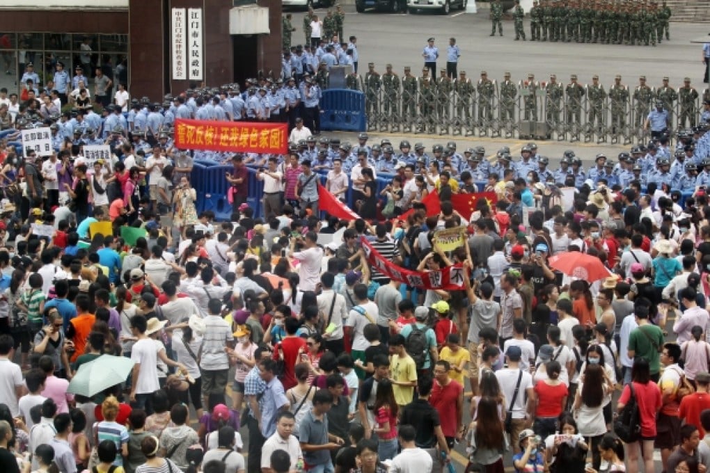 Hundreds of protesters gather outside the municipal headquarters in Jiangmen, even though the government there had pledged to scrap plans for a uranium processing plant. The government later issued the pledge in writing. One protester said the letter would justify further protests if the government broke its promise. Photo: Dickson Lee