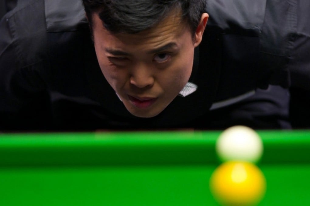 Marco Fu in his match against Neil Robertson. Photo: Xinhua