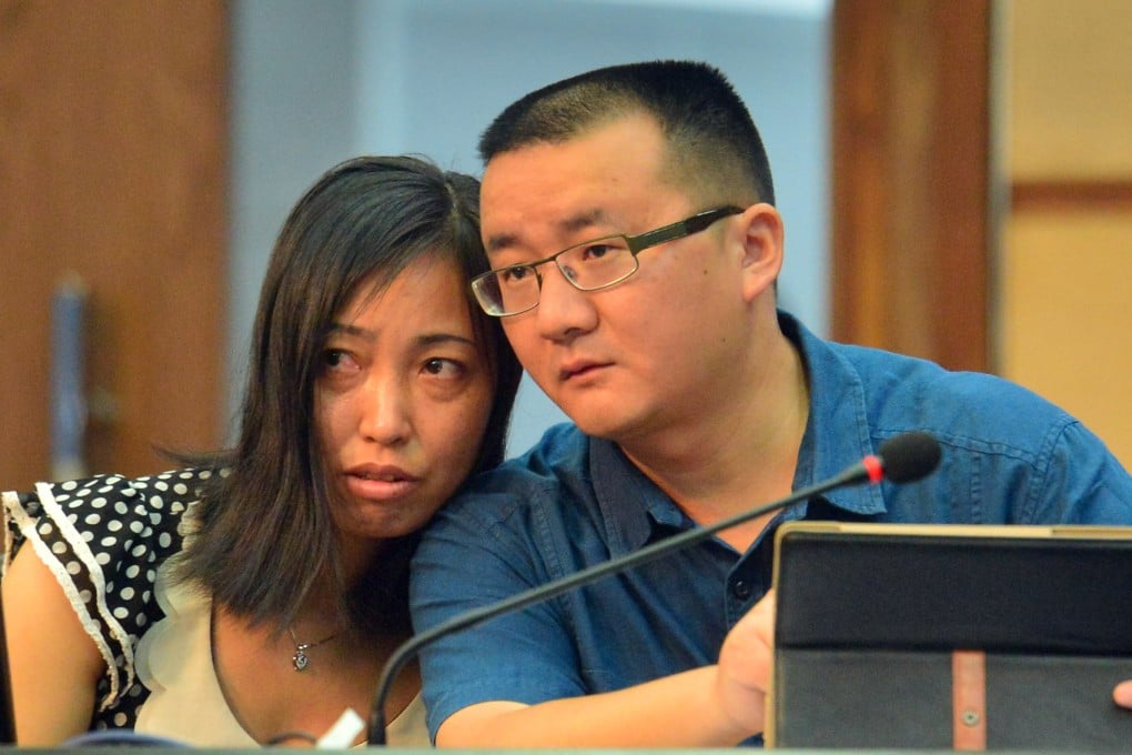 Tang Hui and her lawyer in court, where they heard the judges award her damages on Monday. Photo: AFP