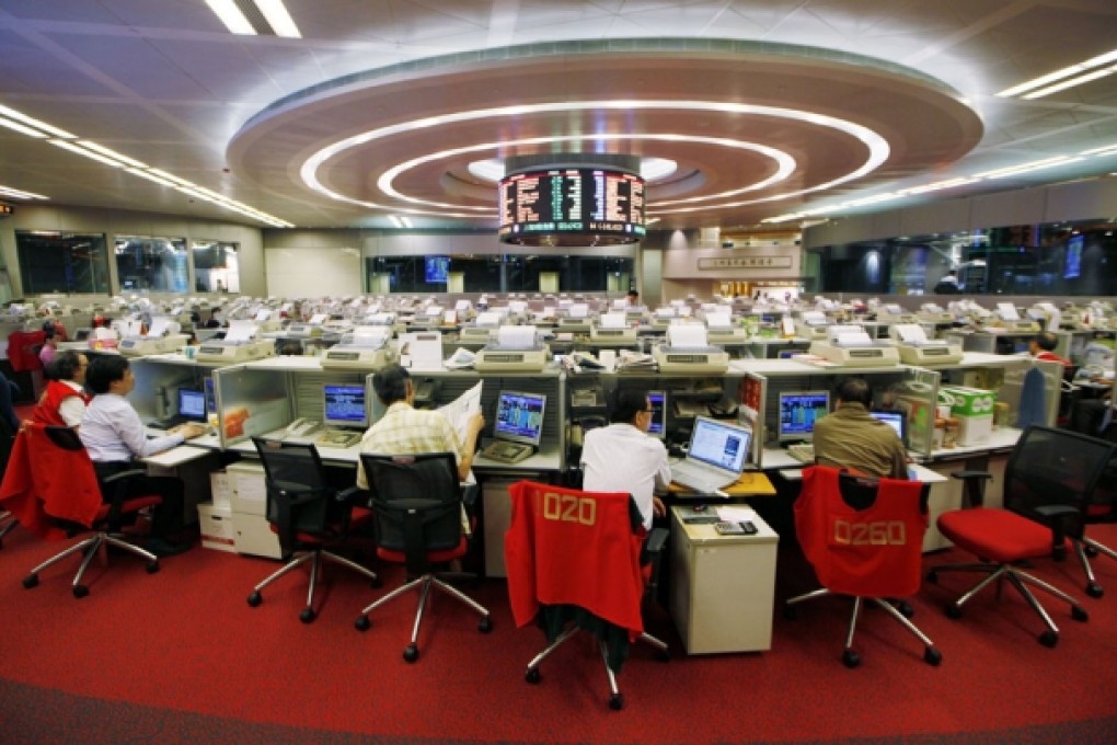 Investors believe bursting of stock market and property bubbles in Hong Kong are the major risks for the city's stock market in the second half of the year. Photo: AP