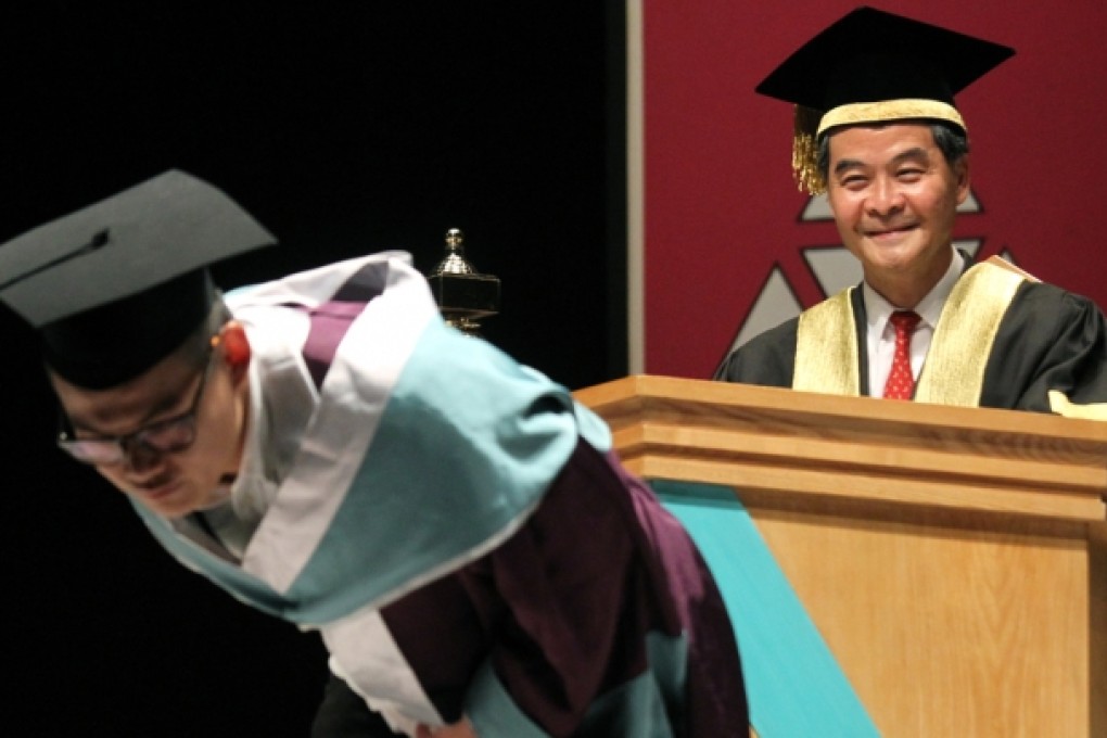 One student pulled up the back of his graduation gown, showing his butt towards the chief executive Leung Chun-ying during this year's graduation ceremony of the Hong Kong Academy for Performing Arts. Photo: SCMP