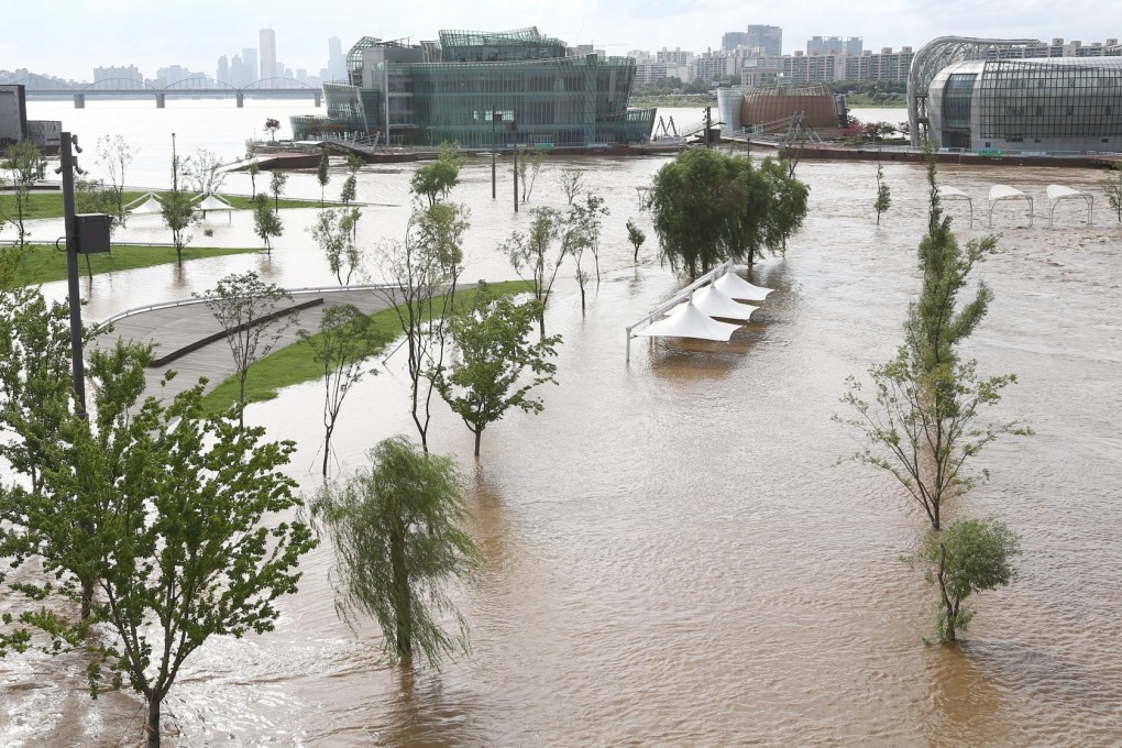 A public park alongside the Han River in central Seoul, South Korea, is under flood water on Monday. Photo: EPA