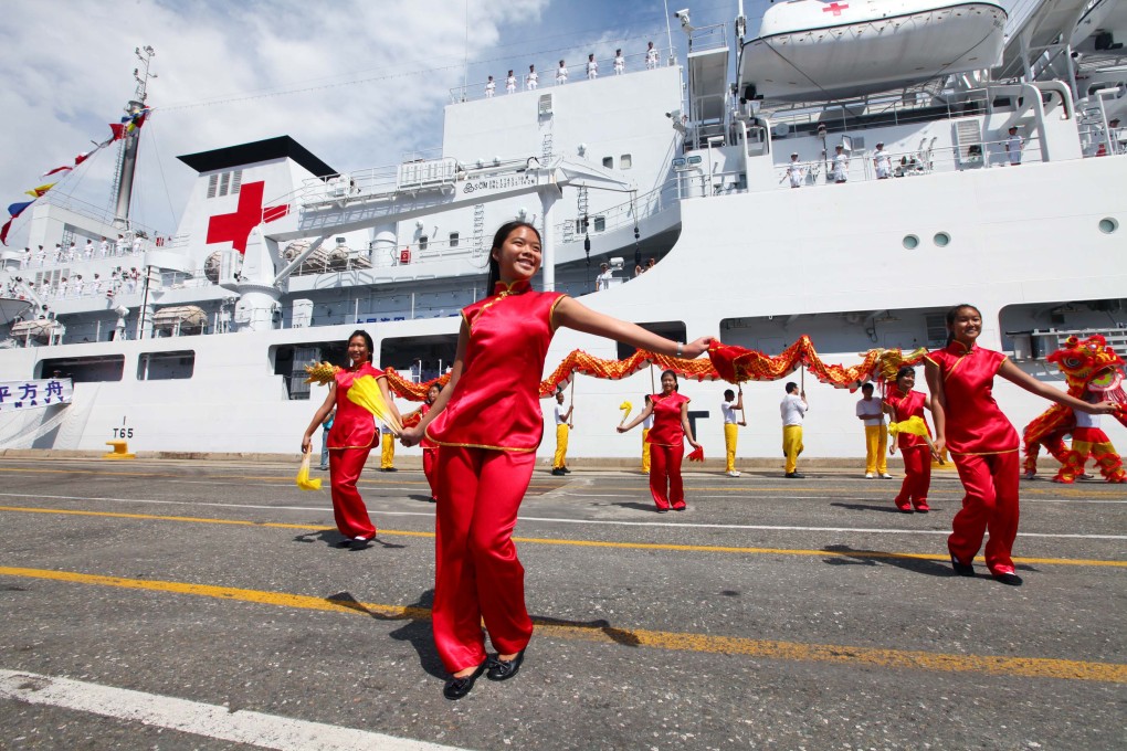 Overseas Chinese dance to welcome the Chinese Navy "Peace Ark" hospital ship in Kingston, Jamaica in 2011.