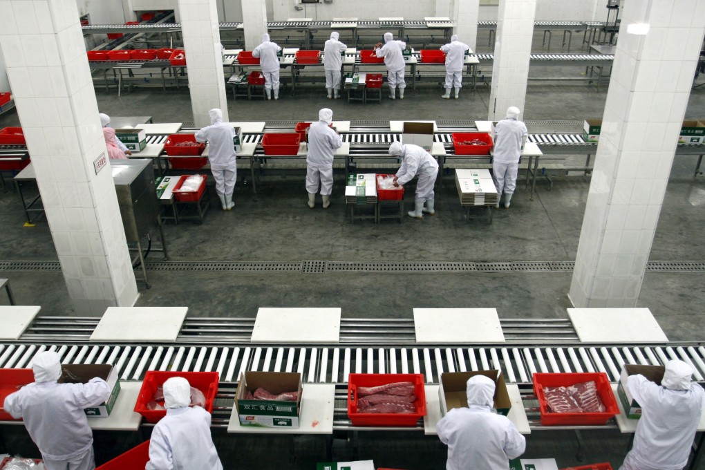 Employees work inside a Shuanghui factory in Zhengzhou, Henan province. Photo: Reuters