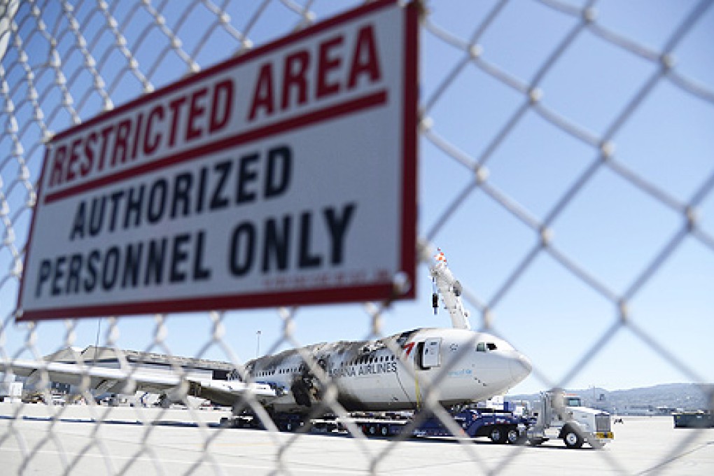 The wreckage of the Asiana Airlines Flight 214 is moved to a secure area away from the runway at San Francisco International Airport in California. Photo: EPA