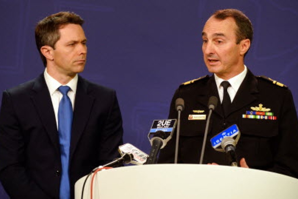 Commander of Border Protection Command, Rear Admiral David Johnston, Royal Australian Navy (right) and Home Affairs Minister Jason Clare, speak to the media during a press conference in Sydney on Wednesday. Photo: AFP