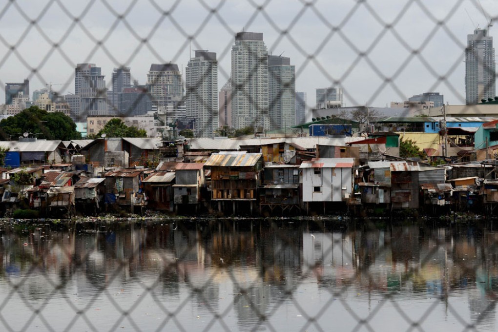 Philippine central bank has raised the limit imposed on microfinance deposit accounts to enable sufficient savings on property investment among low-income groups. Photo: AFP