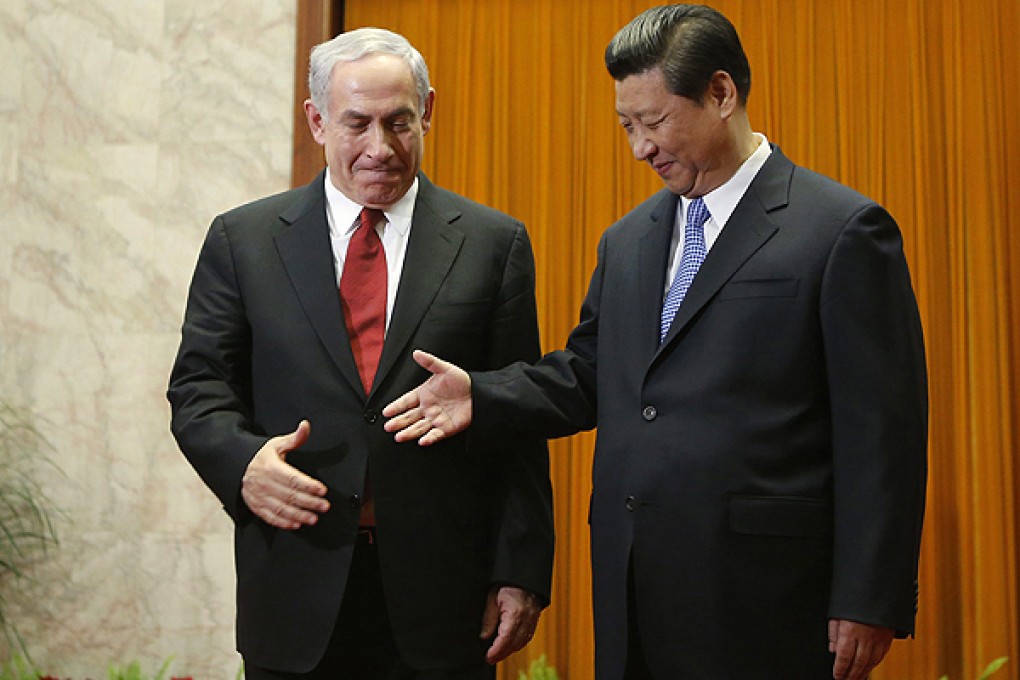 China's President Xi Jinping shakes hands with Israeli Prime Minister Netanyahu in Beijing. Photo: Reuters