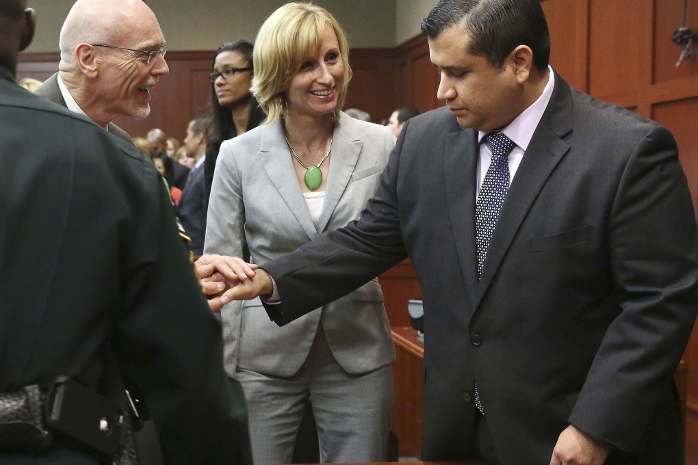 George Zimmerman, right, is congratulated by his defence team after being found not guilty. Photo: AP