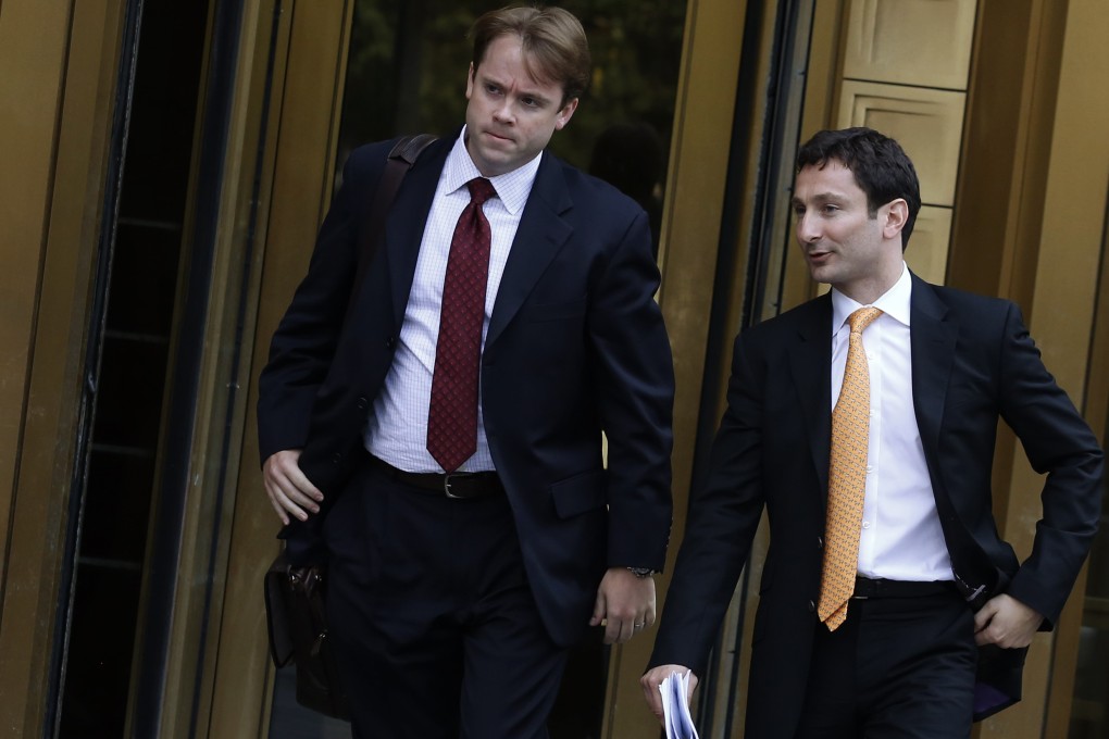 Former Goldman Sachs trader Fabrice Tourre (right) leaves a Manhattan court. Photo: Reuters