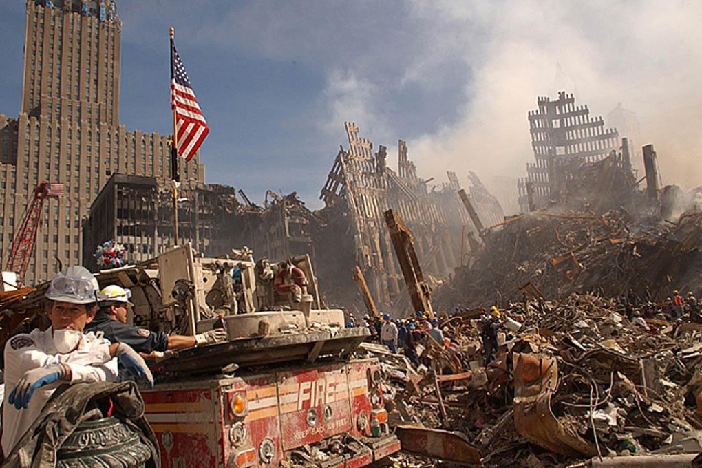 Emergency workers battle fires as they search for survivors at the smouldering ruins of the World Trade Center in New York. Photo: AFP