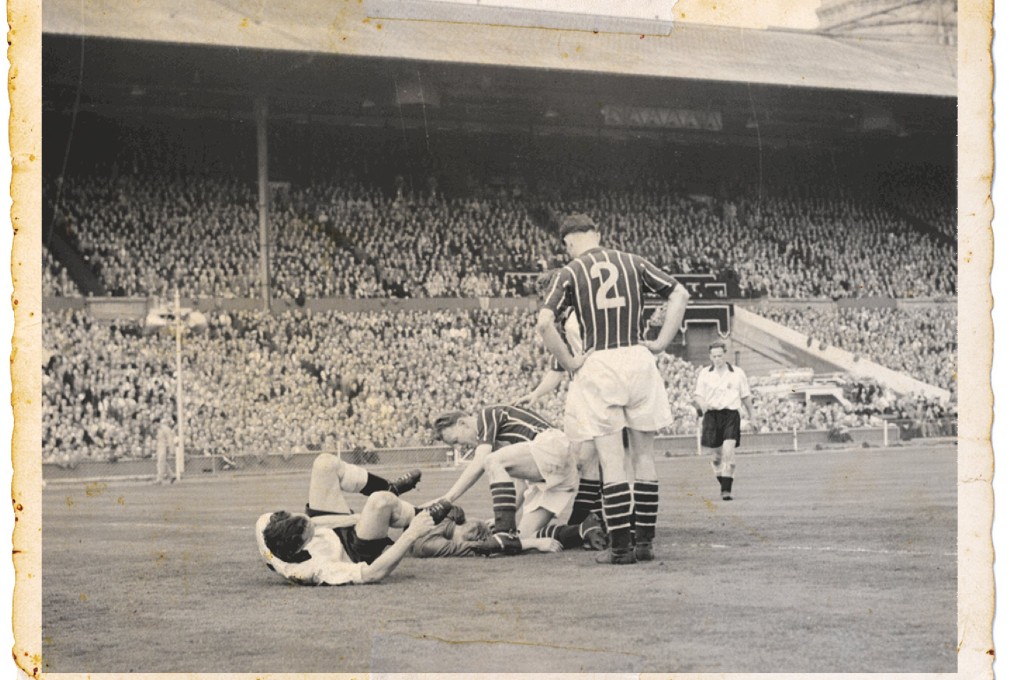 City’s Bert Trautmann is knocked out during their FA Cup final in 1956. Photo: EPA